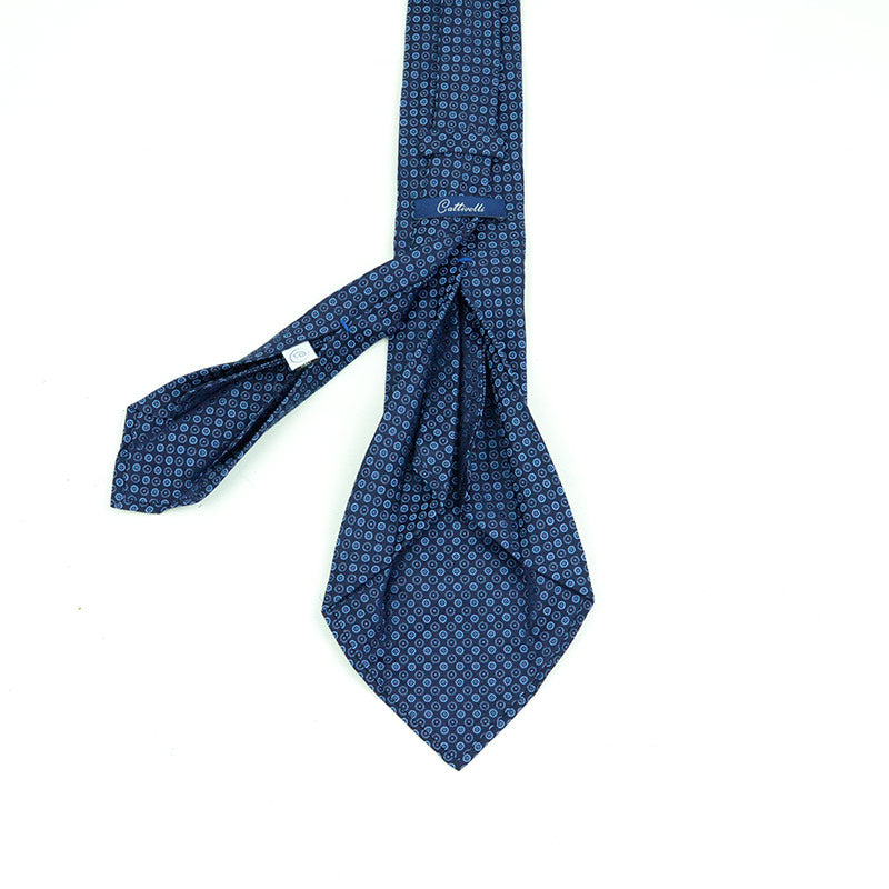 Cravatta a 7 pieghe Fatta a mano con un pattern a geometrie circolari in Blue Royal
